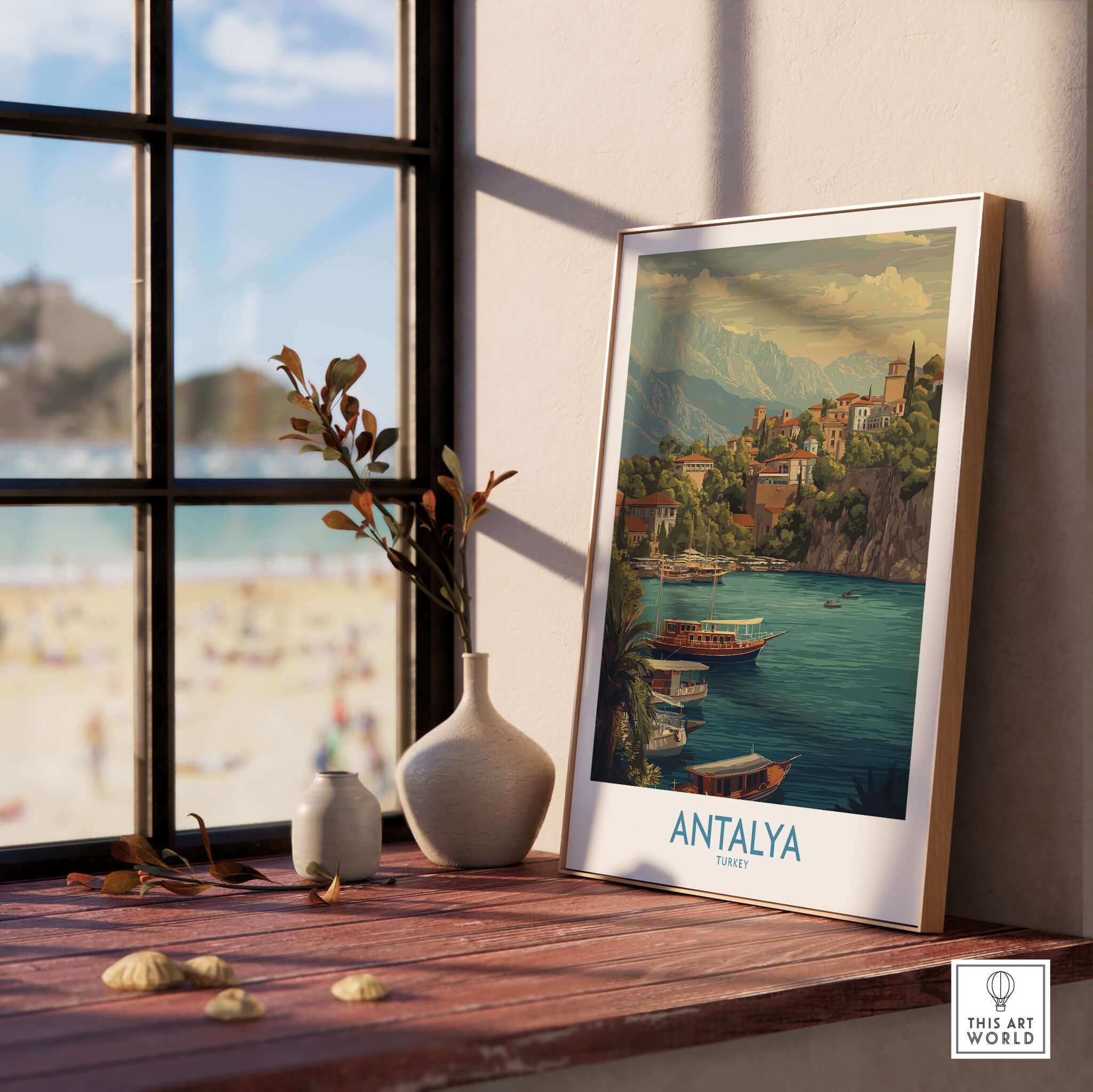 Antalya Turkey Harbour Cliff Art Print | Taurus Mountains View Poster displayed on a windowsill with beach view.
