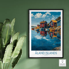 Åland Islands Finland Print | Nordic Coastal Village Poster in a framed display against a green wall with plants.