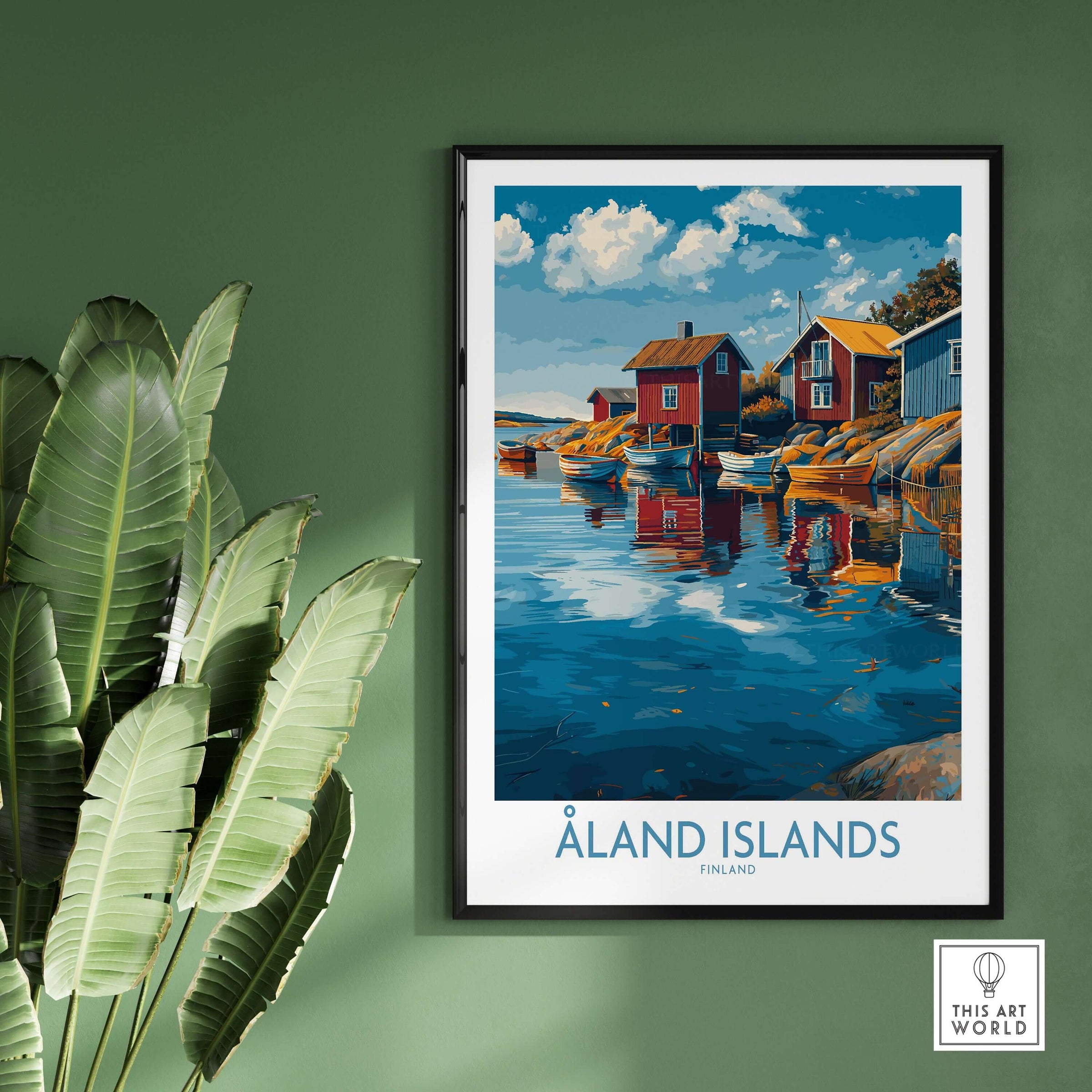 Åland Islands Finland Print | Nordic Coastal Village Poster in a framed display against a green wall with plants.