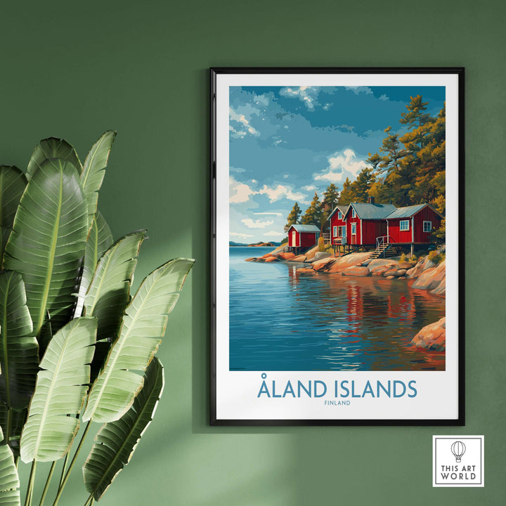 Åland Islands Lakeside Cabin Art Print | Finland Rustic Landscape Poster displayed in a cozy setting with plants.