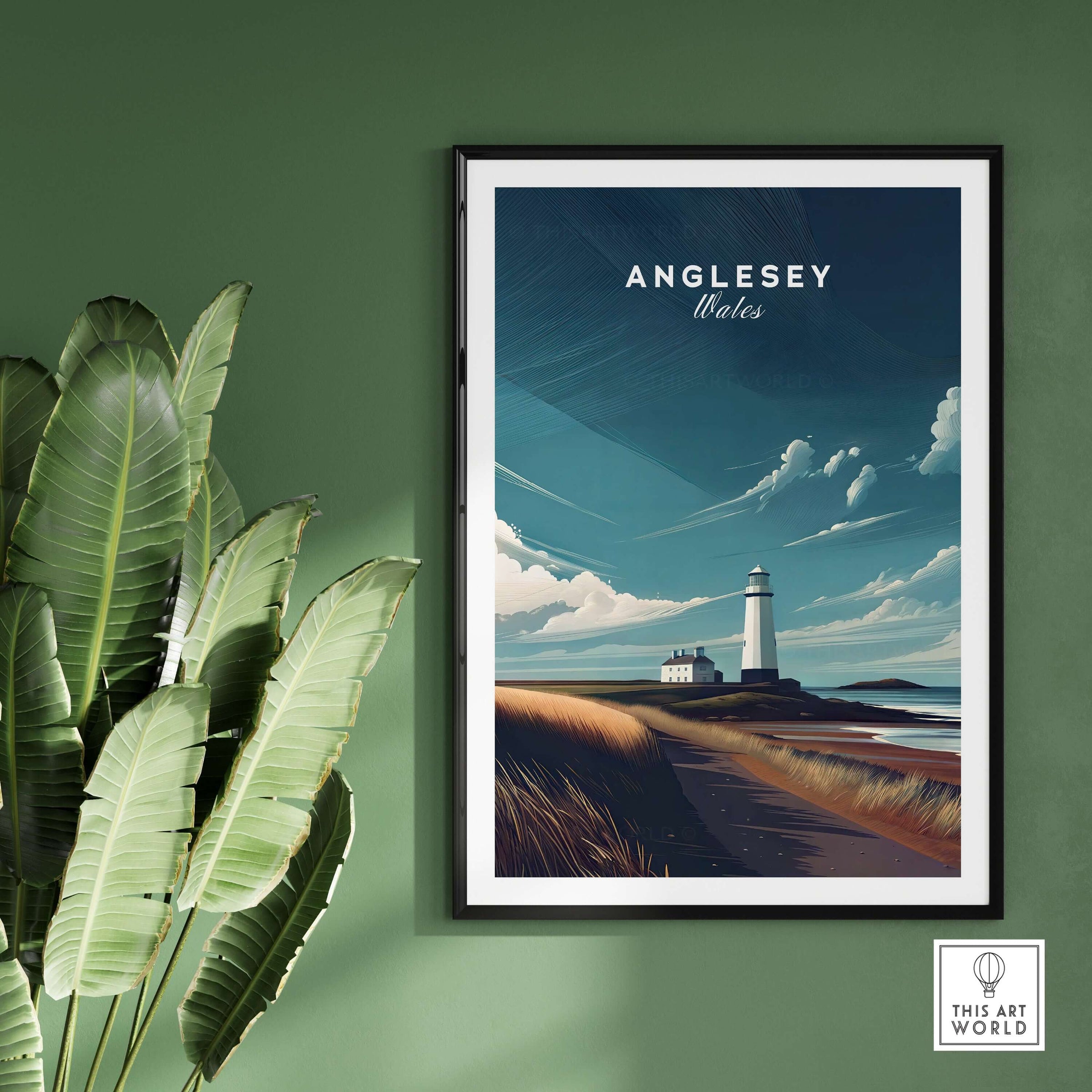 Anglesey Wales Lighthouse Coastal Print - Welsh Landscape Wall Art displayed in a modern room with green walls and plants.