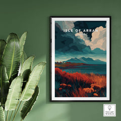 Isle of Arran Scotland Wall Art - Rugged Scottish Highlands Print displayed on green wall with plants.