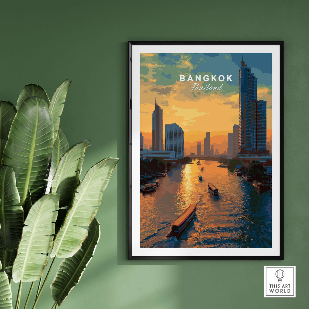 Sunset over Bangkok skyline with river boats on the Chao Phraya, framed poster against a green wall.