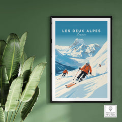 Vibrant Les Deux Alpes travel poster featuring skiers on snow-covered slopes, framed and displayed against a green wall.
