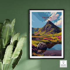 Tryfan Wales Mountain Landscape Print - Snowdonia Valley Wall Art framed on green wall with plants.