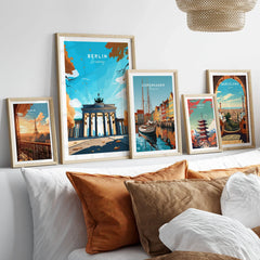 Berlin Poster Blue Sky in a gallery wall set of five framed travel prints in natural wood frames above a bed