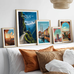 Camino de la Muerte Poster Bolivia Wall Art in a gallery wall set of five framed travel prints in natural wood frames above a bed