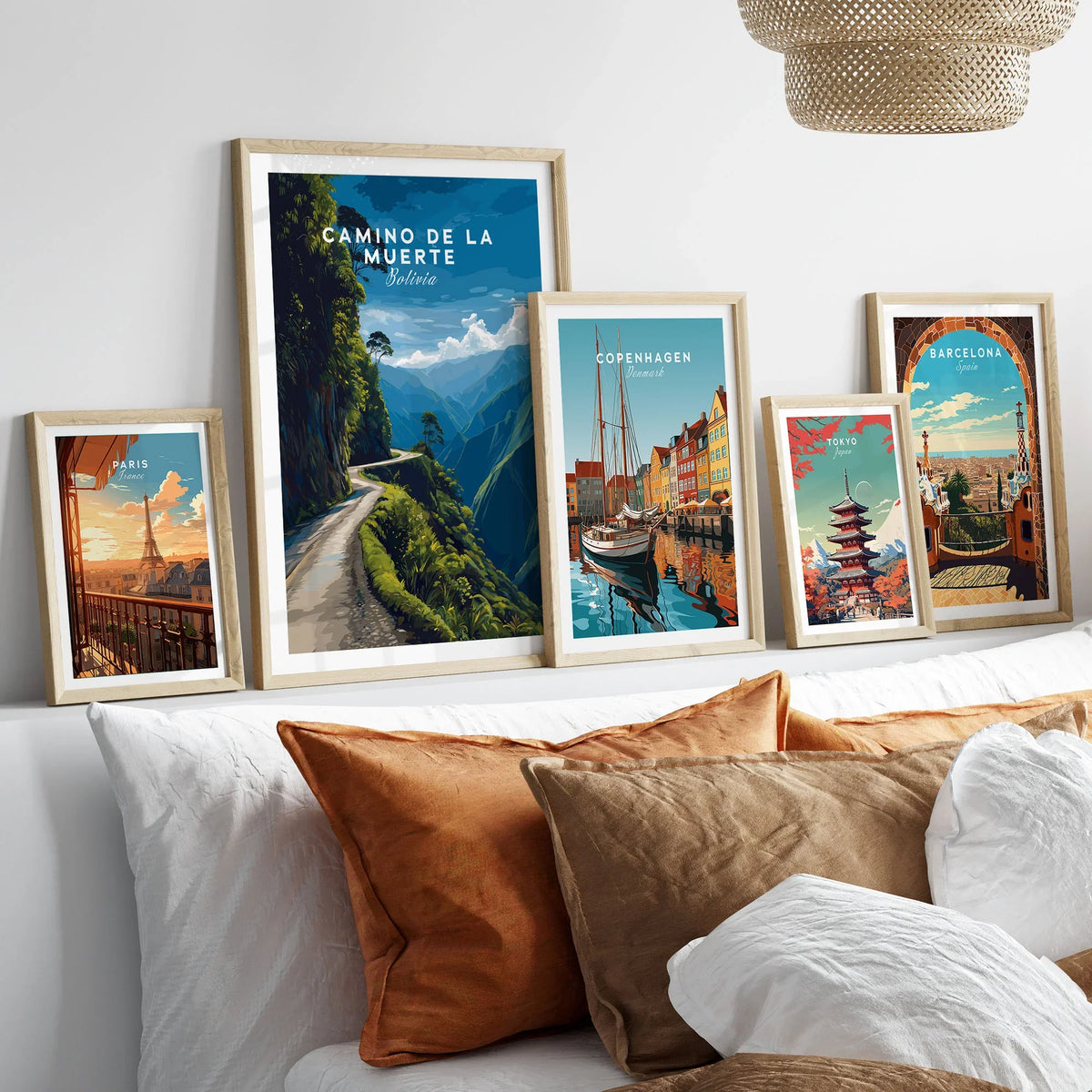 Camino de la Muerte Poster Bolivia Wall Art in a gallery wall set of five framed travel prints in natural wood frames above a bed