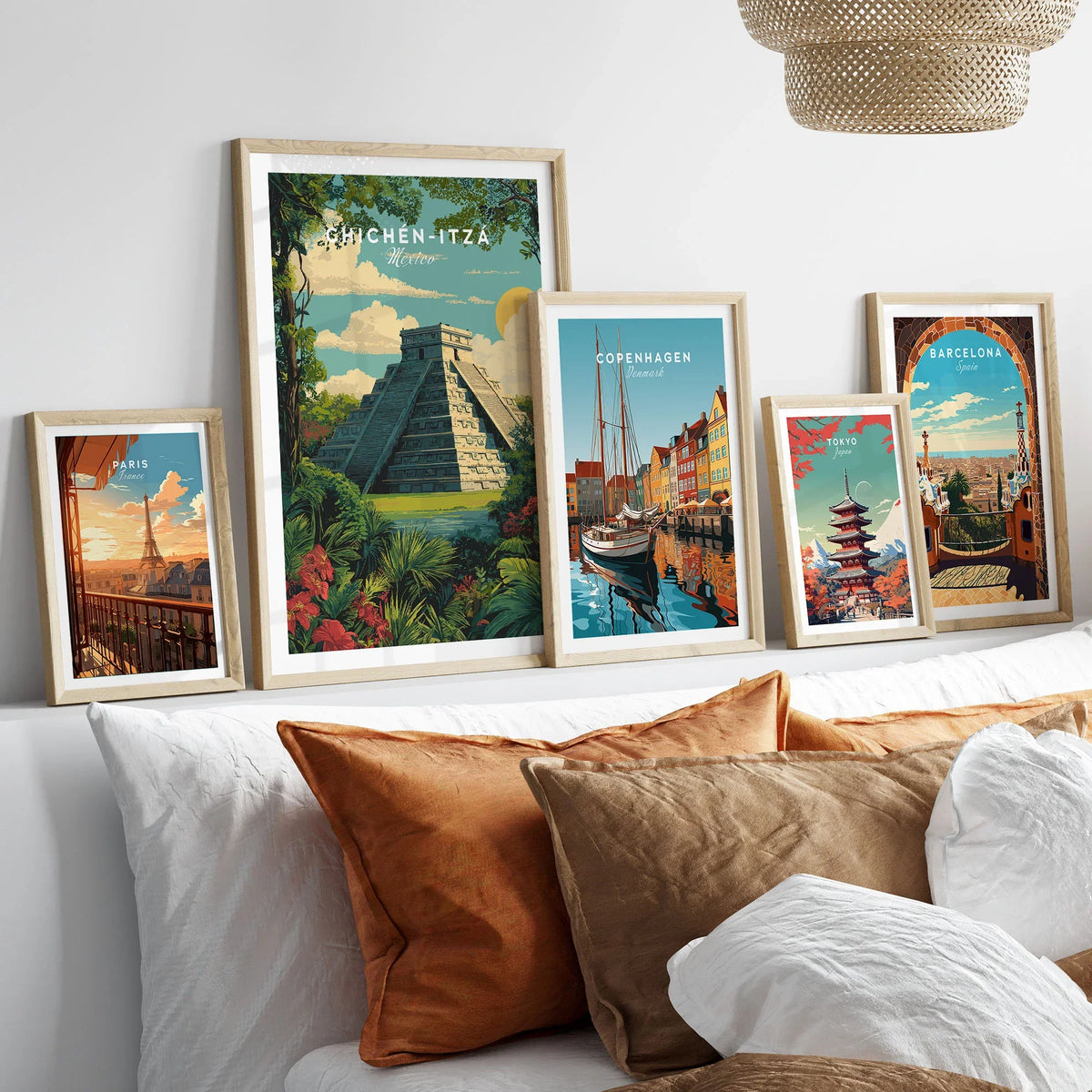 Chichén Itzá Mexico Travel Poster Pyramid Jungle Print Mayan Ruins Wall Art Decor in a gallery wall set of five framed travel prints in natural wood frames above a bed