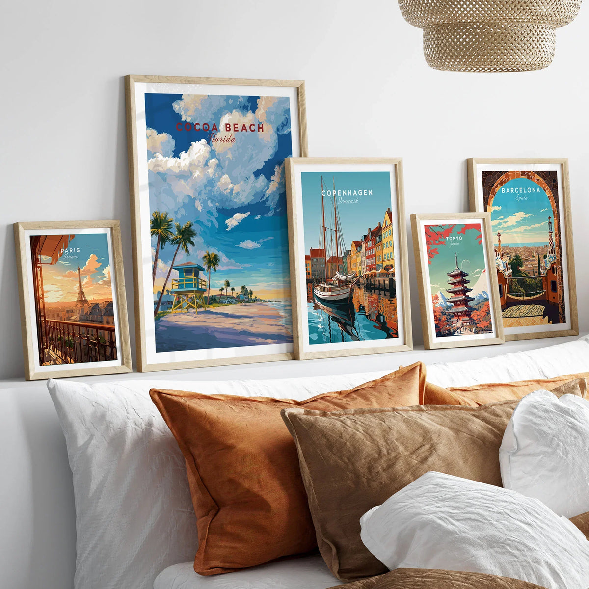 Cocoa Beach Lifeguard Tower Poster - Palm Tree Beach Wall Art in a gallery wall set of five framed travel prints in natural wood frames above a bed