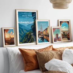 Death Road Yungas Adventure Scenic Print | Bolivian Travel Wall Decor in a gallery wall set of five framed travel prints in natural wood frames above a bed