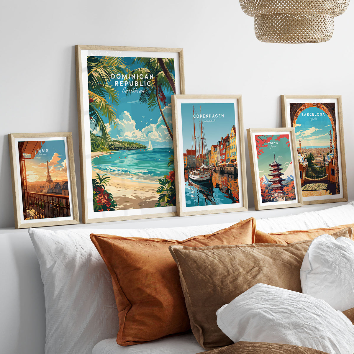 Dominican Republic Travel Print in a gallery wall set of five framed travel prints in natural wood frames above a bed
