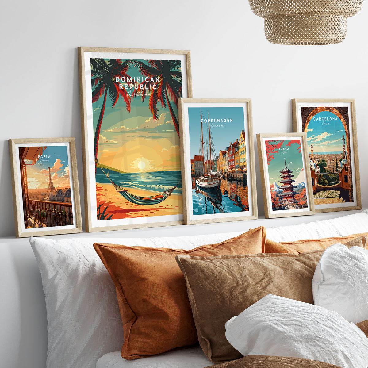 Dominican Republic Travel Poster in a gallery wall set of five framed travel prints in natural wood frames above a bed