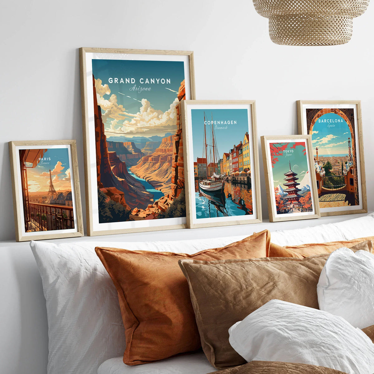 Grand Canyon Poster in a gallery wall set of five framed travel prints in natural wood frames above a bed