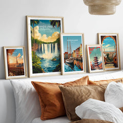 Iguazu Falls Wall Art in a gallery wall set of five framed travel prints in natural wood frames above a bed