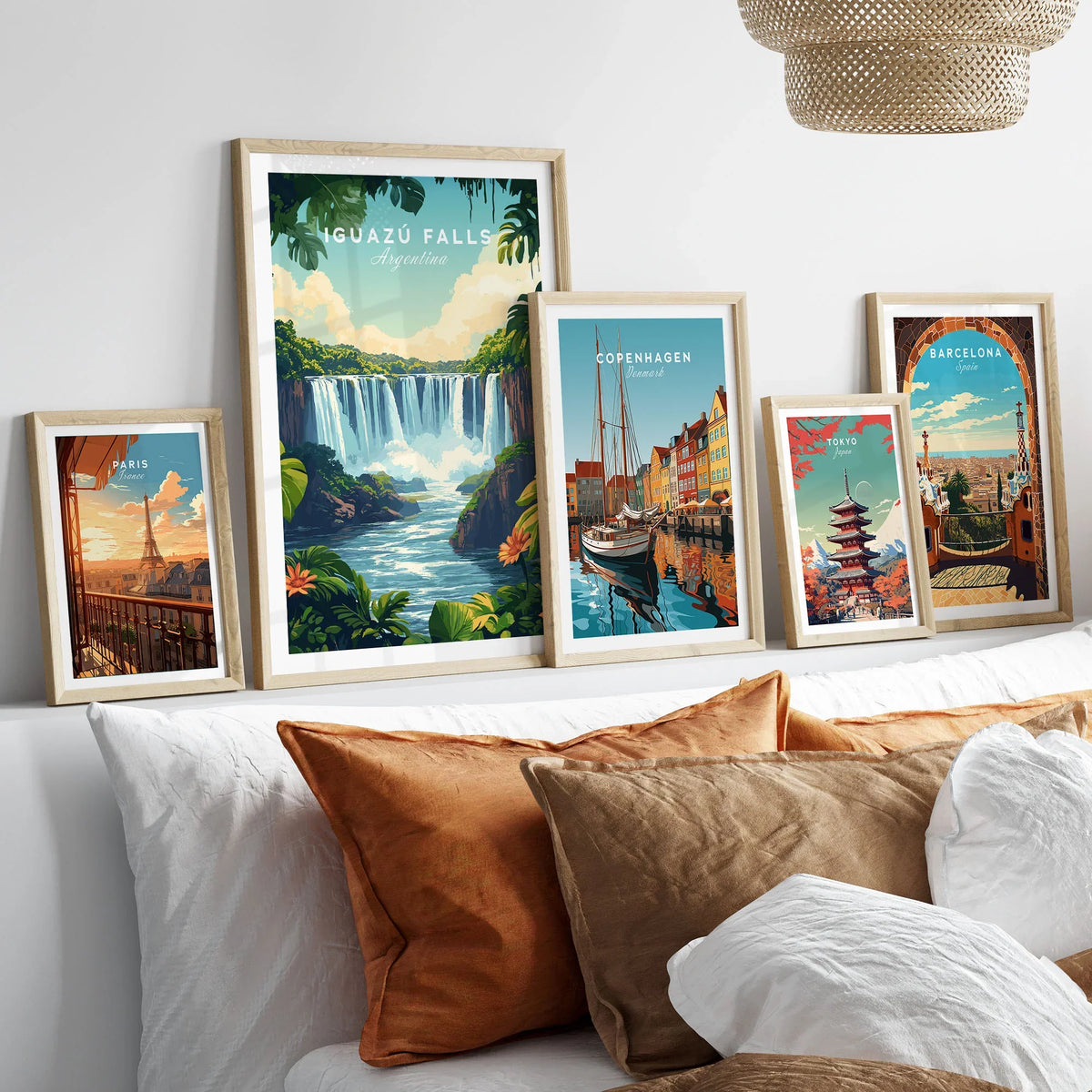 Iguazu Falls Print Argentina in a gallery wall set of five framed travel prints in natural wood frames above a bed