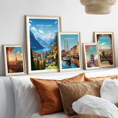Interlaken Poster in a gallery wall set of five framed travel prints in natural wood frames above a bed