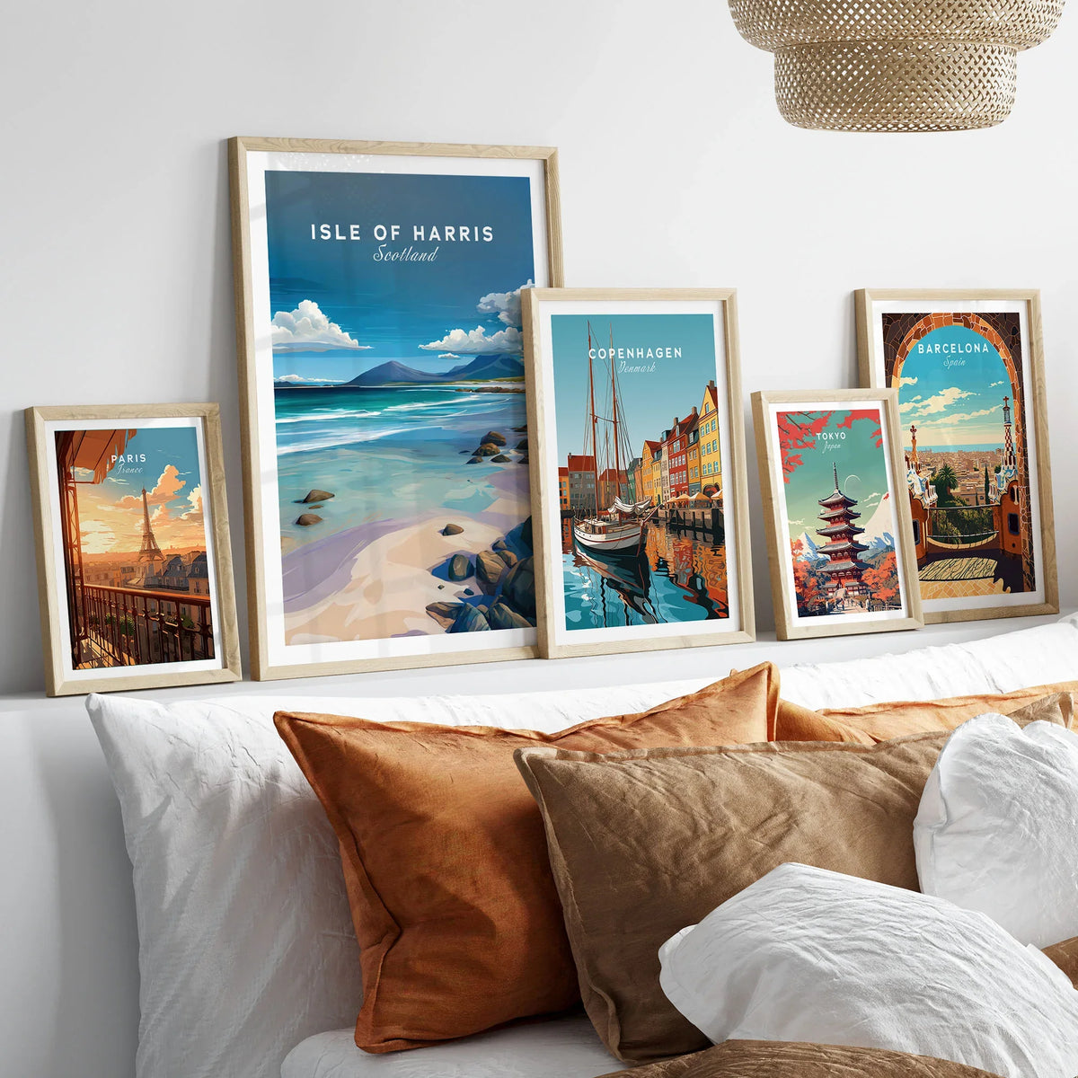 Isle of Harris Scotland Blue Sky Beach Print - Rocky Coastline Wall Art in a gallery wall set of five framed travel prints in natural wood frames above a bed