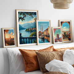 Lake Maggiore Travel Poster in a gallery wall set of five framed travel prints in natural wood frames above a bed