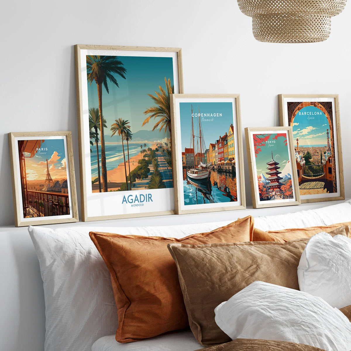 Agadir Morocco Wall Art Canvas in a gallery wall set of five framed travel prints in natural wood frames above a bed