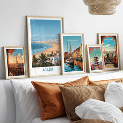 Agadir Morocco Print – Panoramic Beach and Palm Tree Wall Decor in a gallery wall set of five framed travel prints in natural wood frames above a bed