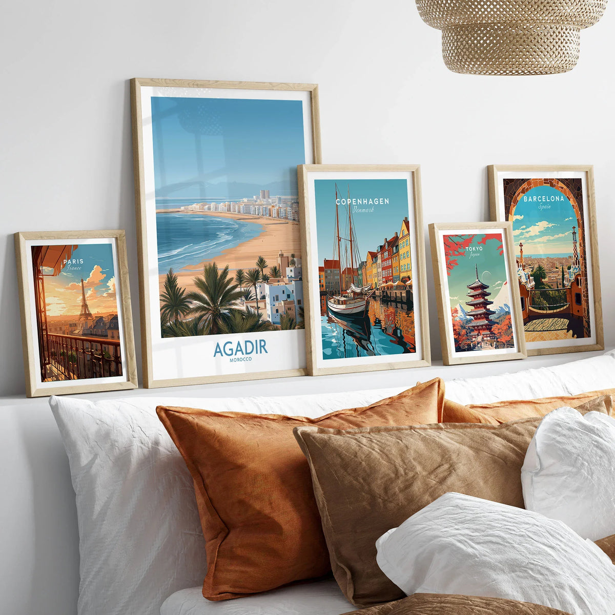 Agadir Morocco Print – Panoramic Beach and Palm Tree Wall Decor in a gallery wall set of five framed travel prints in natural wood frames above a bed