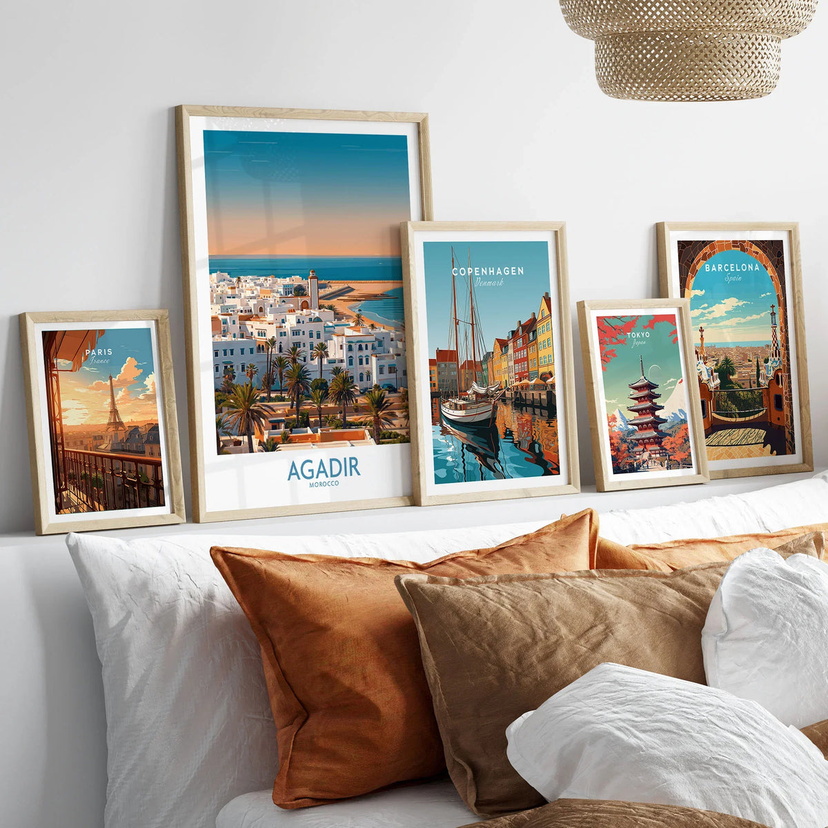 Agadir Morocco Wall Art – Mediterranean Canvas Art in a gallery wall set of five framed travel prints in natural wood frames above a bed