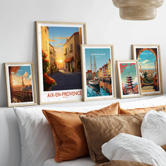 Aix-en-Provence Wall Art in a gallery wall set of five framed travel prints in natural wood frames above a bed