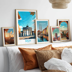 Berlin Wall Art Modern in a gallery wall set of five framed travel prints in natural wood frames above a bed