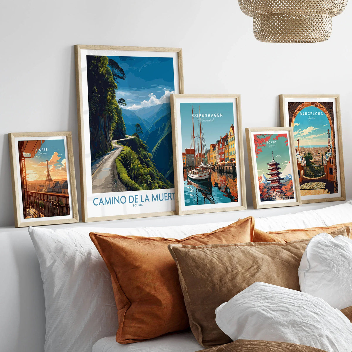 Camino de la Muerte Bolivia Cliff Road Wall Art — the Yungas cliff road curving along a jungle mountainside above the Bolivian Andes, shown as set five framed artprints above bed natural wood frames