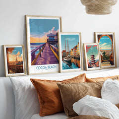 Cocoa Beach Florida Wooden Pier Poster - Golden Hour Sunset Decor in a gallery wall set of five framed travel prints in natural wood frames above a bed
