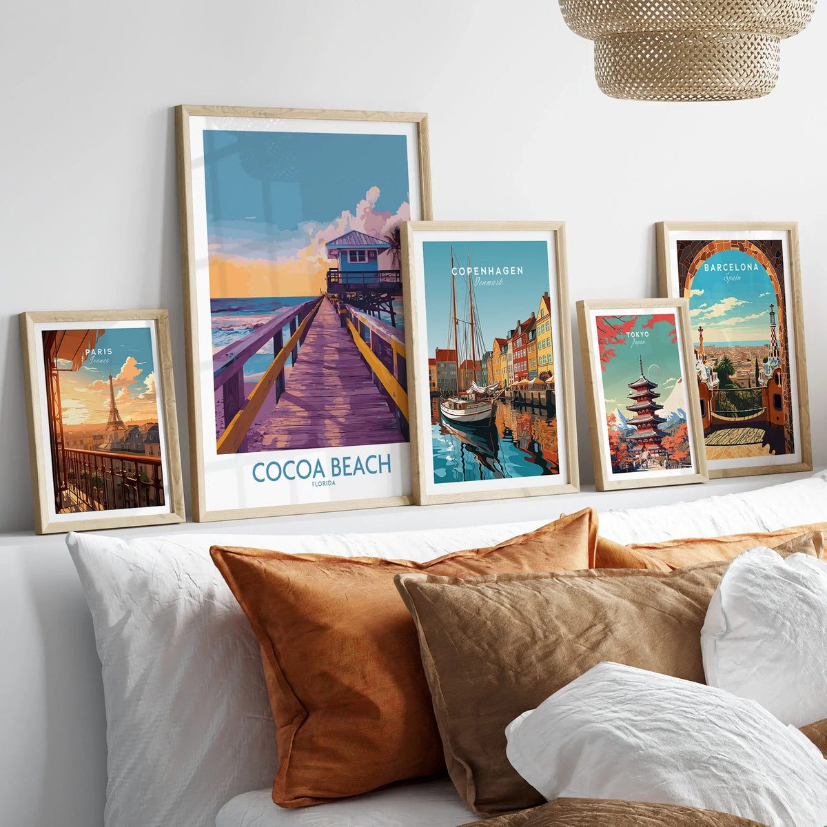 Cocoa Beach Florida Wooden Pier Poster - Golden Hour Sunset Decor in a gallery wall set of five framed travel prints in natural wood frames above a bed