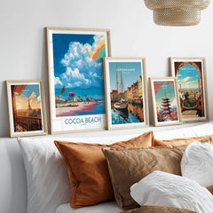Cocoa Beach Rainbow Cloud Poster - Florida Travel Decor in a gallery wall set of five framed travel prints in natural wood frames above a bed