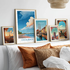 Cocoa Beach Kennedy Space Center Poster - Florida Wall Art Decor in a gallery wall set of five framed travel prints in natural wood frames above a bed