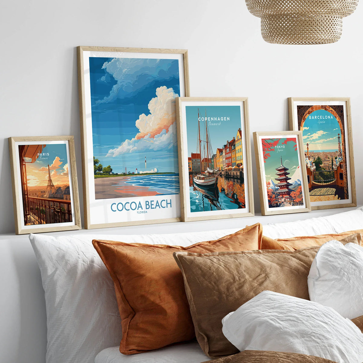 Cocoa Beach Kennedy Space Center Poster - Florida Wall Art Decor in a gallery wall set of five framed travel prints in natural wood frames above a bed