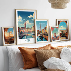 Cork Ireland Poster in a gallery wall set of five framed travel prints in natural wood frames above a bed