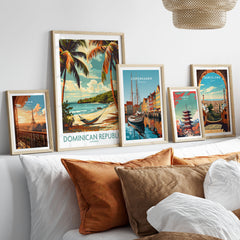 Dominican Republic Print in a gallery wall set of five framed travel prints in natural wood frames above a bed