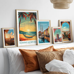 Dominican Republic Wall Art in a gallery wall set of five framed travel prints in natural wood frames above a bed