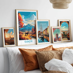 Glencoe Art Print Modern in a gallery wall set of five framed travel prints in natural wood frames above a bed