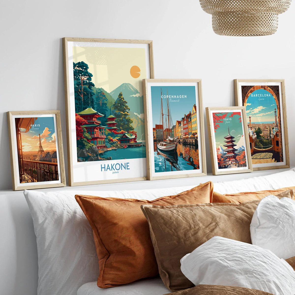 Hakone Japan Lake Ashi Temple Print - Japanese Pagoda Wall Art - Modern in a gallery wall set of five framed travel prints in natural wood frames above a bed