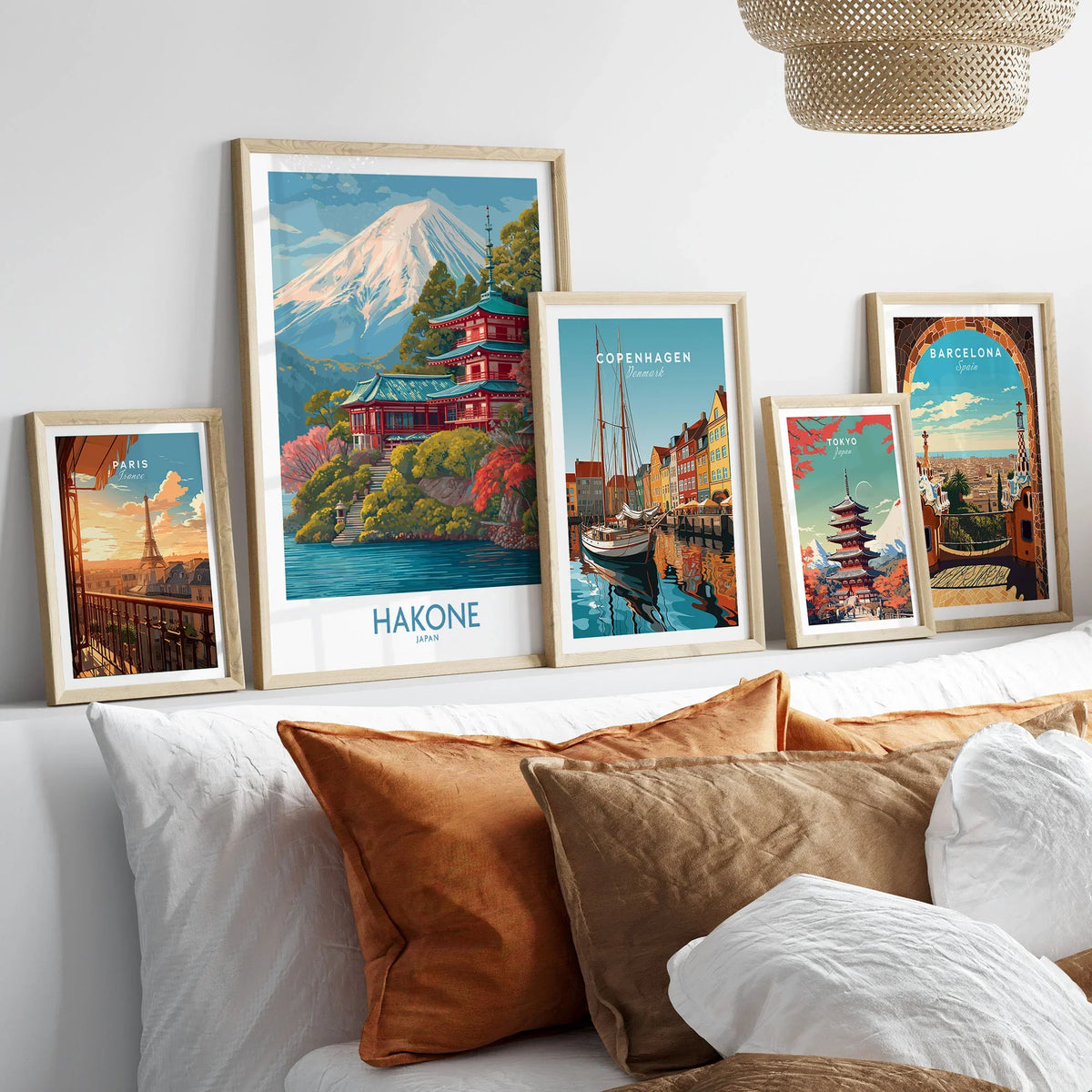 Hakone Japan Wall Art - Japan Travel Print in a gallery wall set of five framed travel prints in natural wood frames above a bed
