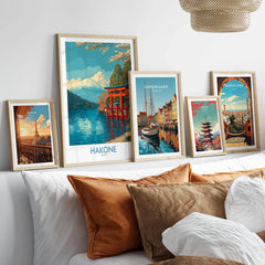 Hakone Wall Art Japan Red Torii Gate Poster in a gallery wall set of five framed travel prints in natural wood frames above a bed