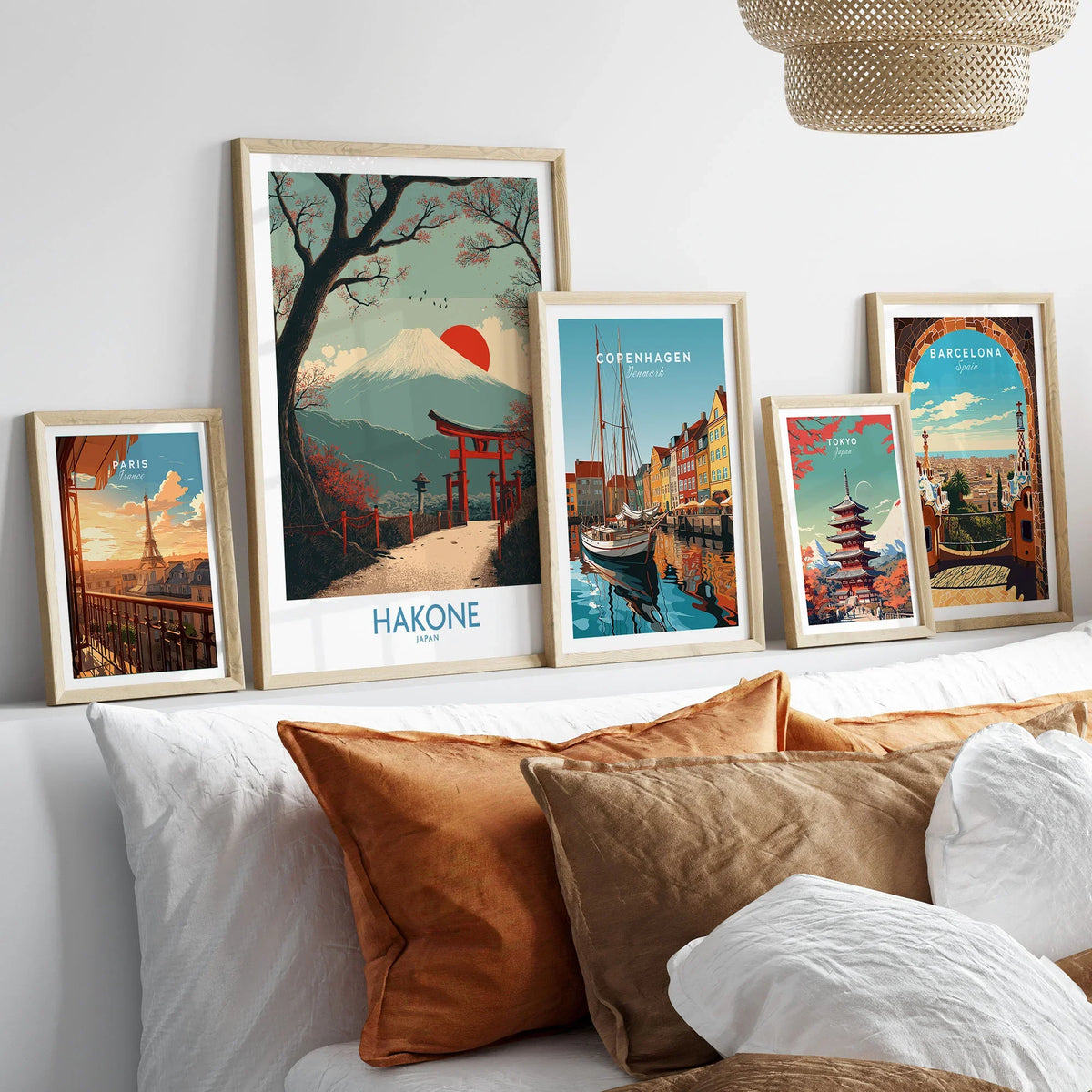 Hakone Japan Peace Gate Shrine Wall Art - Autumn Cherry Blossom Decor in a gallery wall set of five framed travel prints in natural wood frames above a bed