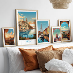 Ibiza Poster Print Modern in a gallery wall set of five framed travel prints in natural wood frames above a bed