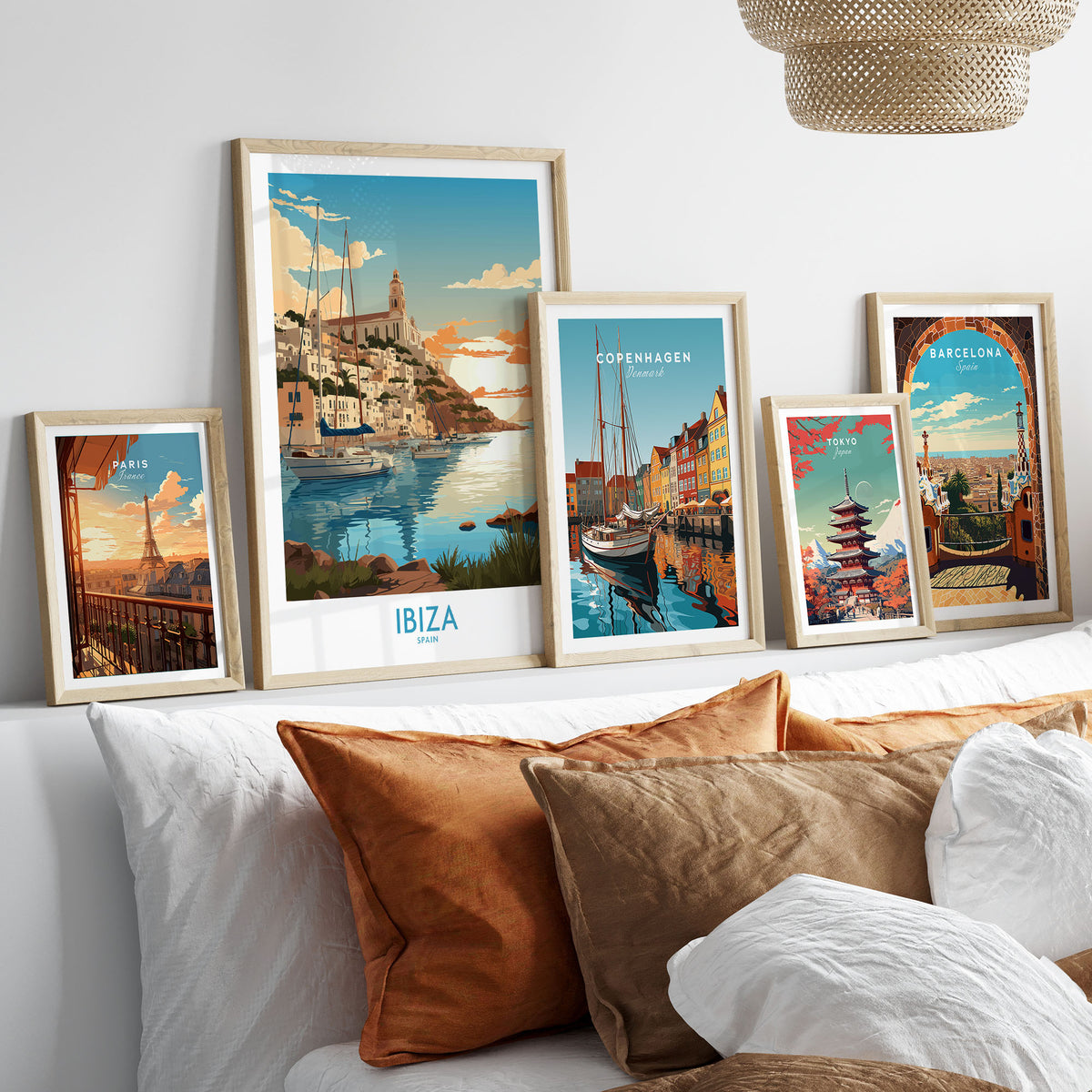 Ibiza Poster Print Modern in a gallery wall set of five framed travel prints in natural wood frames above a bed