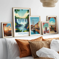 Iguazu Falls Poster Argentina in a gallery wall set of five framed travel prints in natural wood frames above a bed