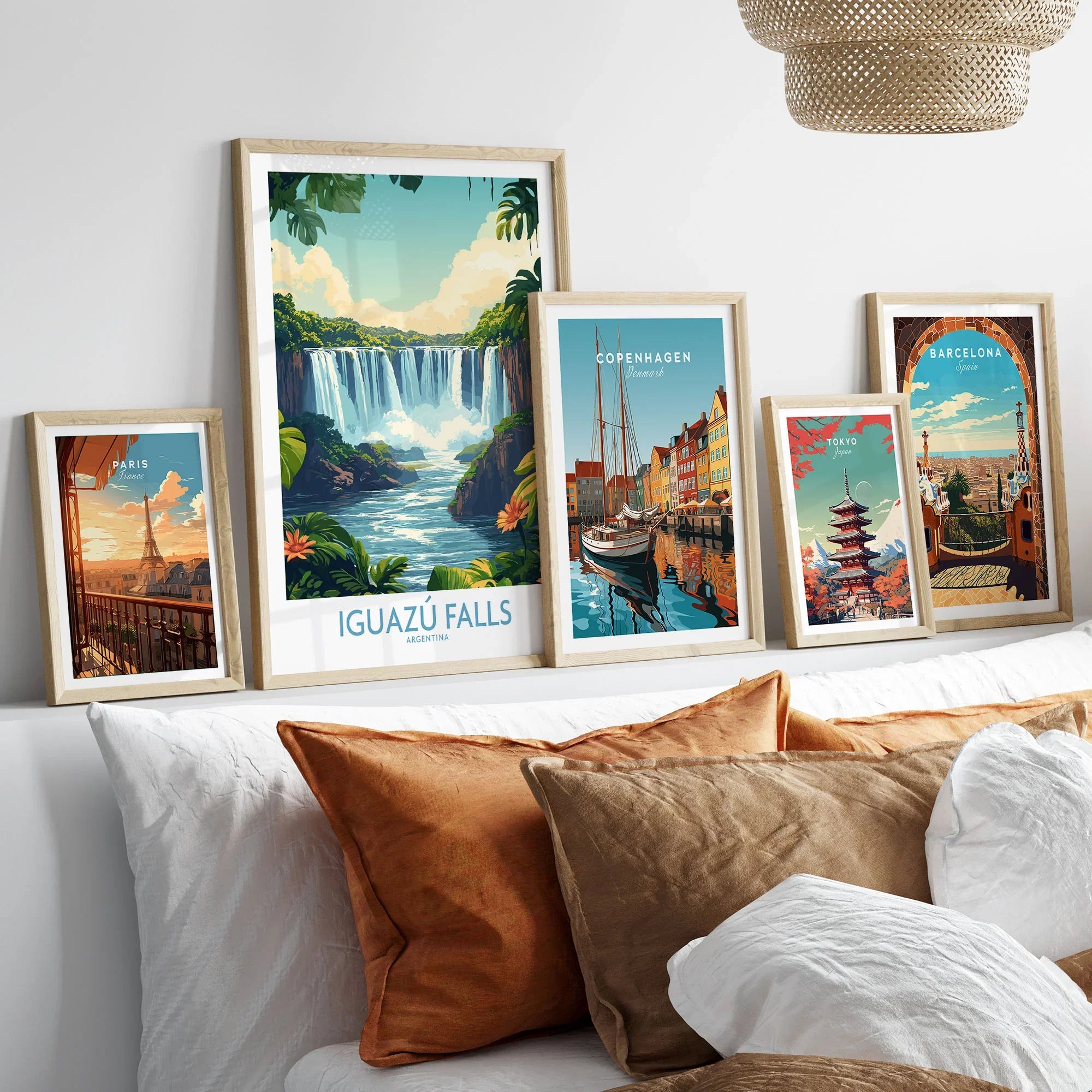 Iguazu Falls Poster Argentina in a gallery wall set of five framed travel prints in natural wood frames above a bed