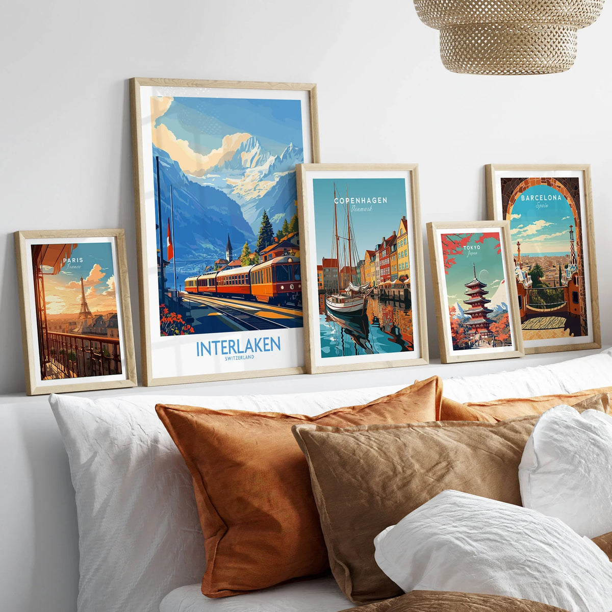 Interlaken Wall Art Print No. 2 in a gallery wall set of five framed travel prints in natural wood frames above a bed