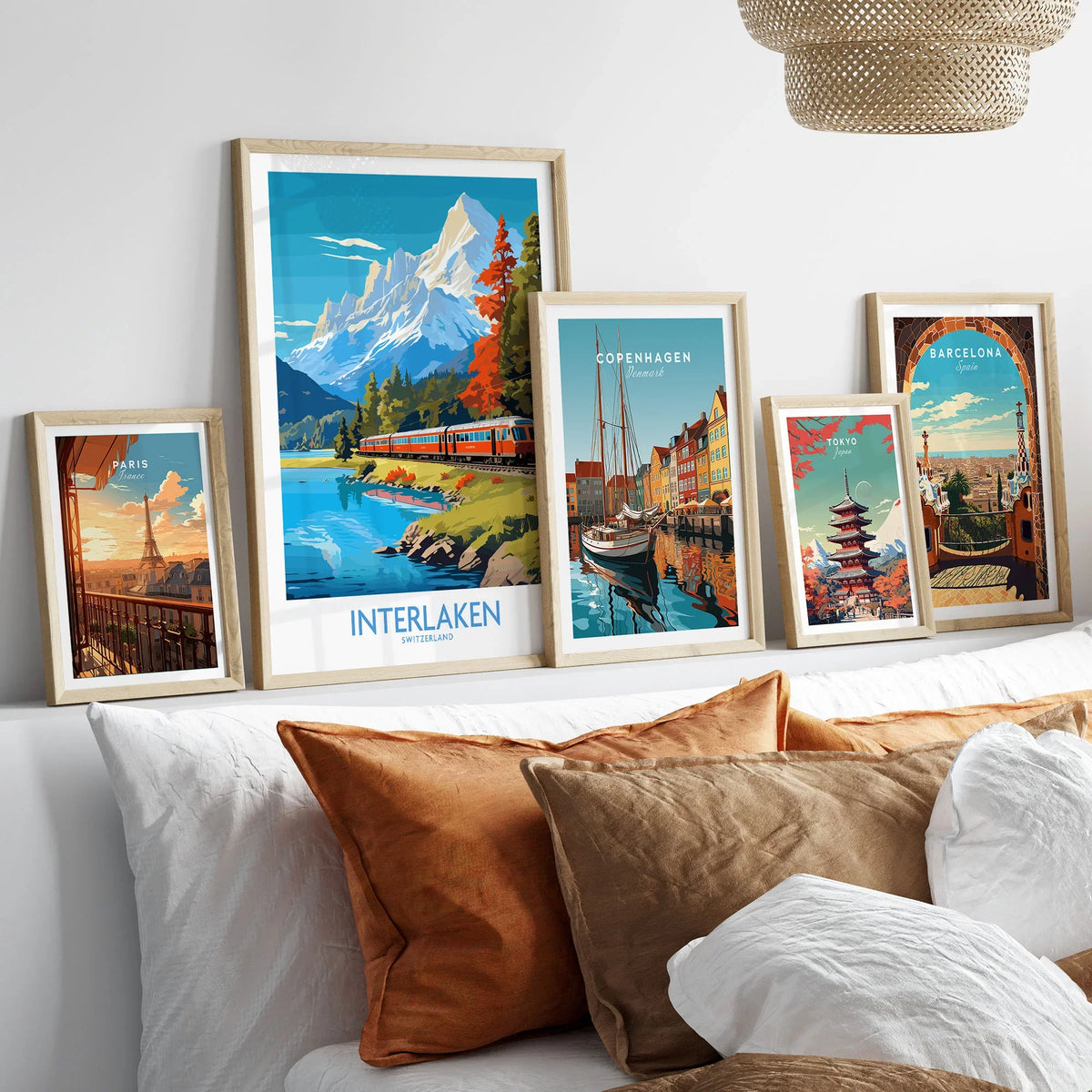 Interlaken Poster Switzerland in a gallery wall set of five framed travel prints in natural wood frames above a bed