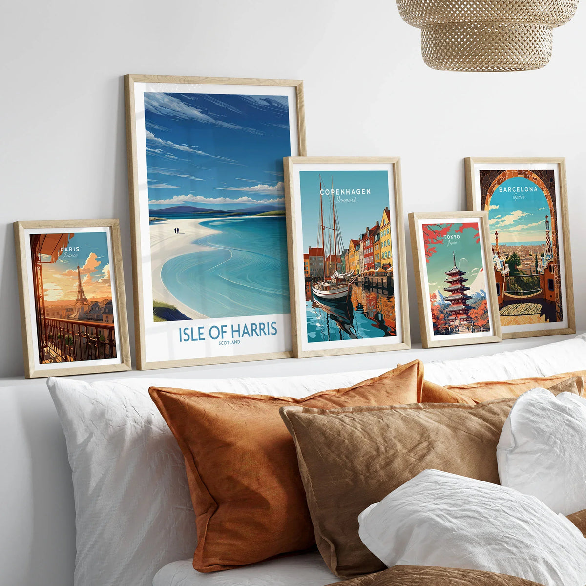 Isle of Harris Poster Scotland - Outer Hebrides Travel Print in a gallery wall set of five framed travel prints in natural wood frames above a bed